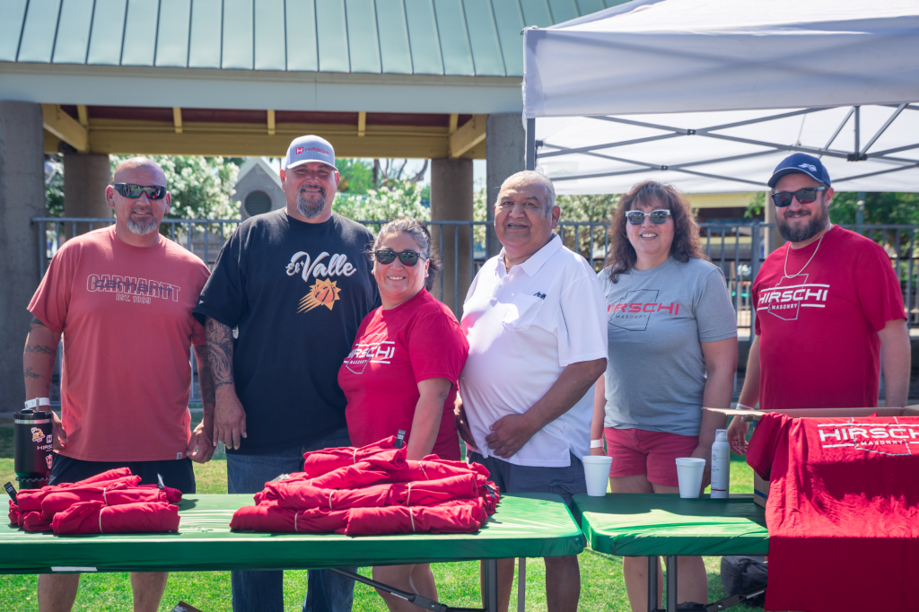 This picture includes a total of 6 people with 3 of them matching Hirschi Shirts as part of a fundraiser. Made by Hirschi Co., in Las Vegas, Nevada