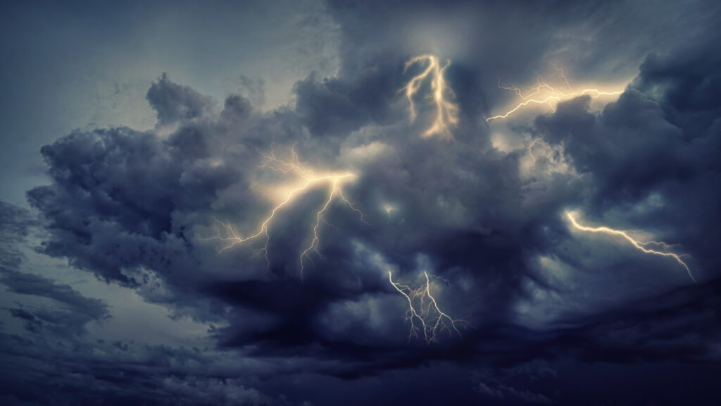 A storm of clouds in the sky in Las Vegas, Nevada, with lighting strikes in the air.
